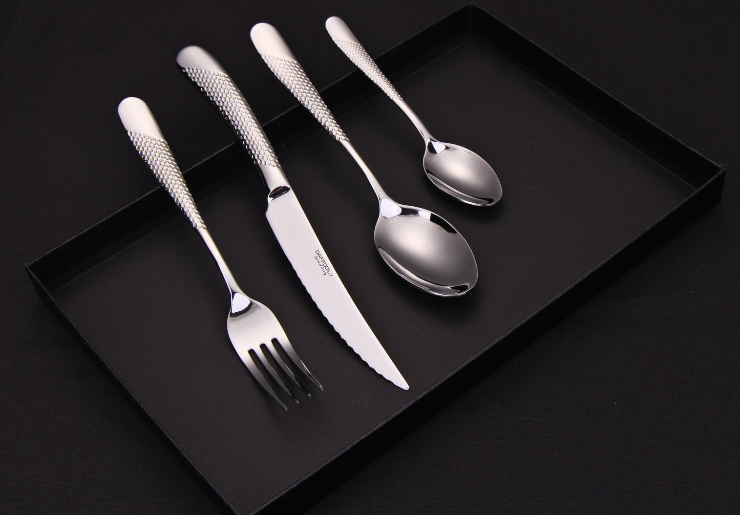 Classic silver cutlery set with intricate detailing